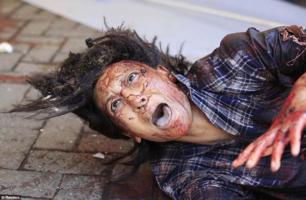 An injured woman screams for help during the shooting at Westgate shopping mall in Nairobi.